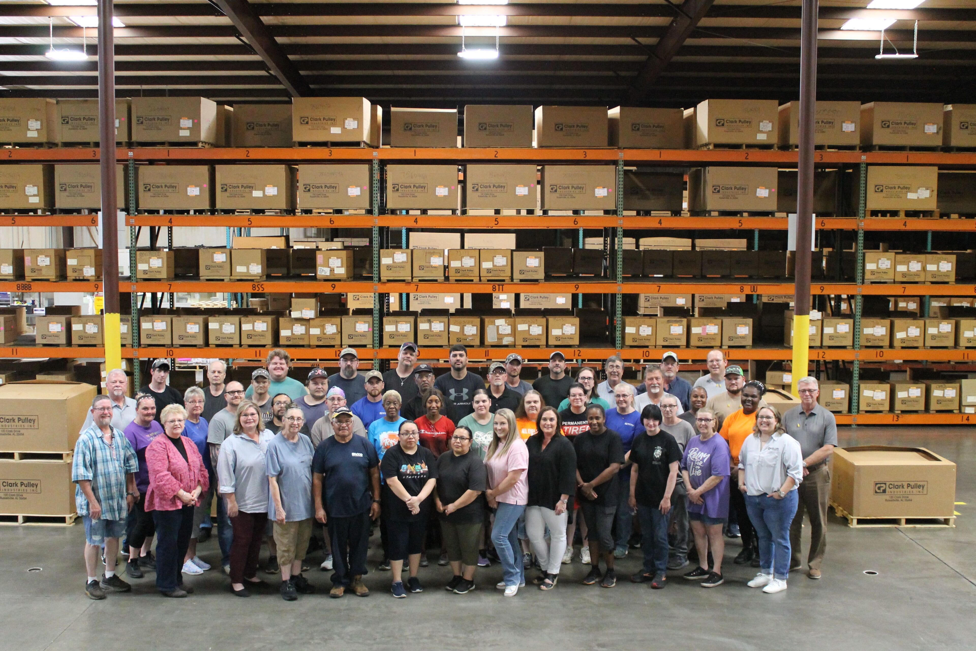 A group of people standing in front of shelves.